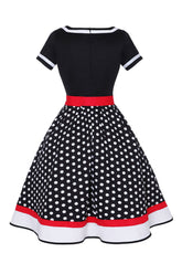 Schwarzes Polka Dots Rockabilly Kleid mit V-Ausschnitt aus den 1950er Jahren